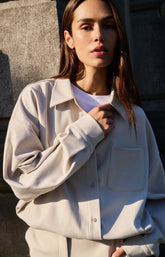 Blouse with asymmetric button placket and elastic hem