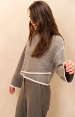 Knitted sweater with contrasting lines