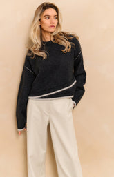 Knitted sweater with contrasting lines