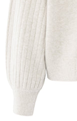 Knitted sweater with ribbed sleeves and round neck
