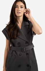 Long sleeveless coat with lapels and waist belt