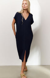 Sleeveless dress with double V-neck and front slit