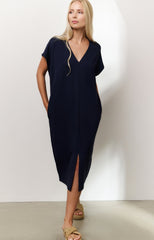 Sleeveless dress with double V-neck and front slit
