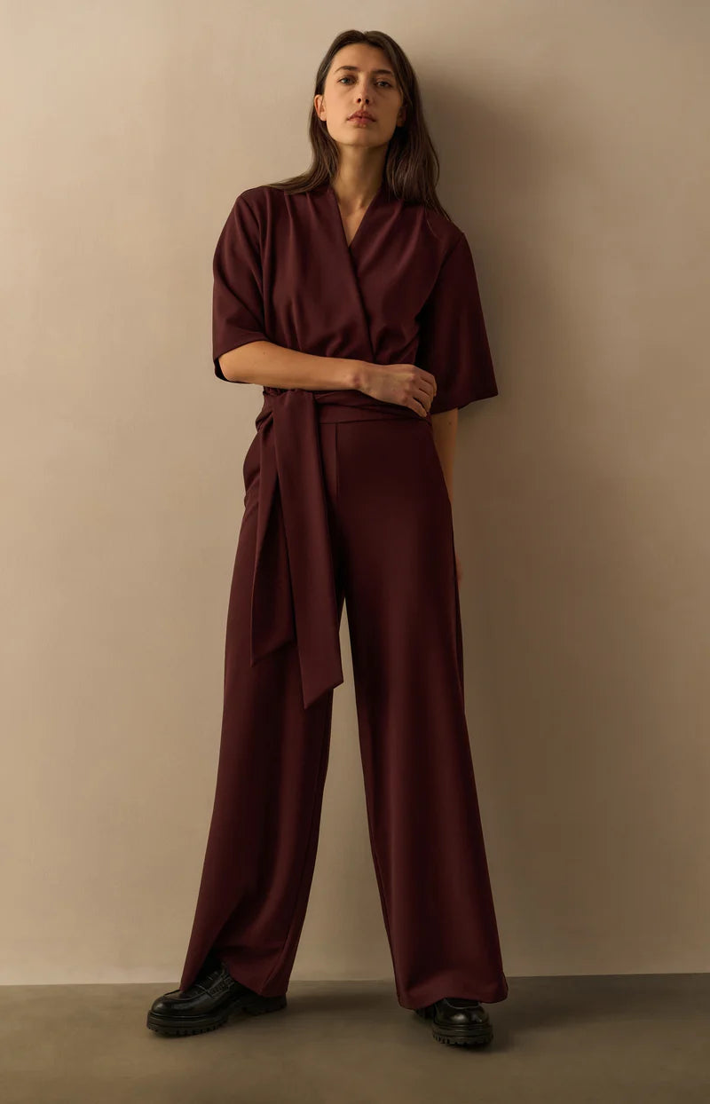 Jersey jumpsuit with short sleeves and tie belt