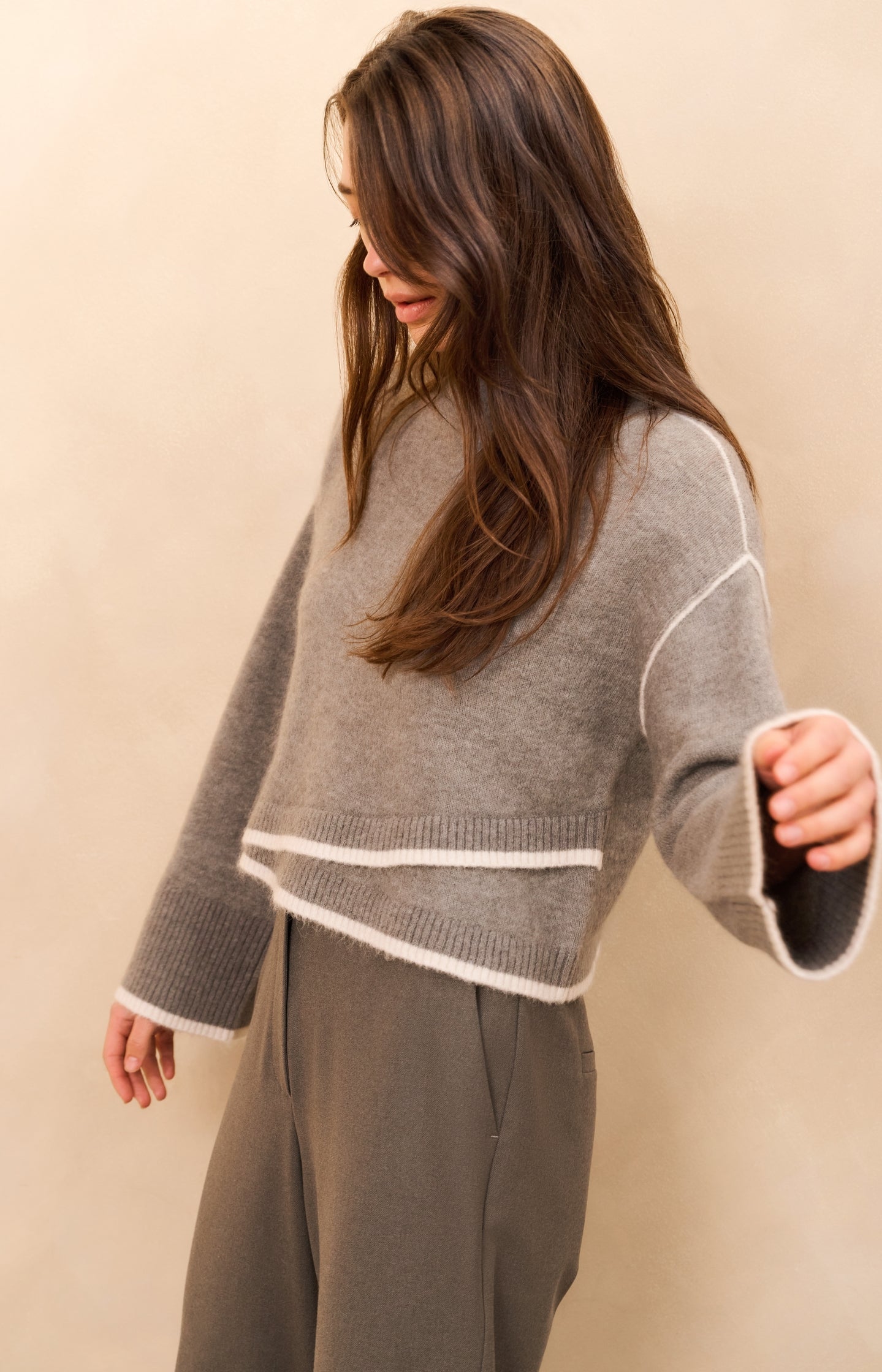 Knitted sweater with contrasting lines