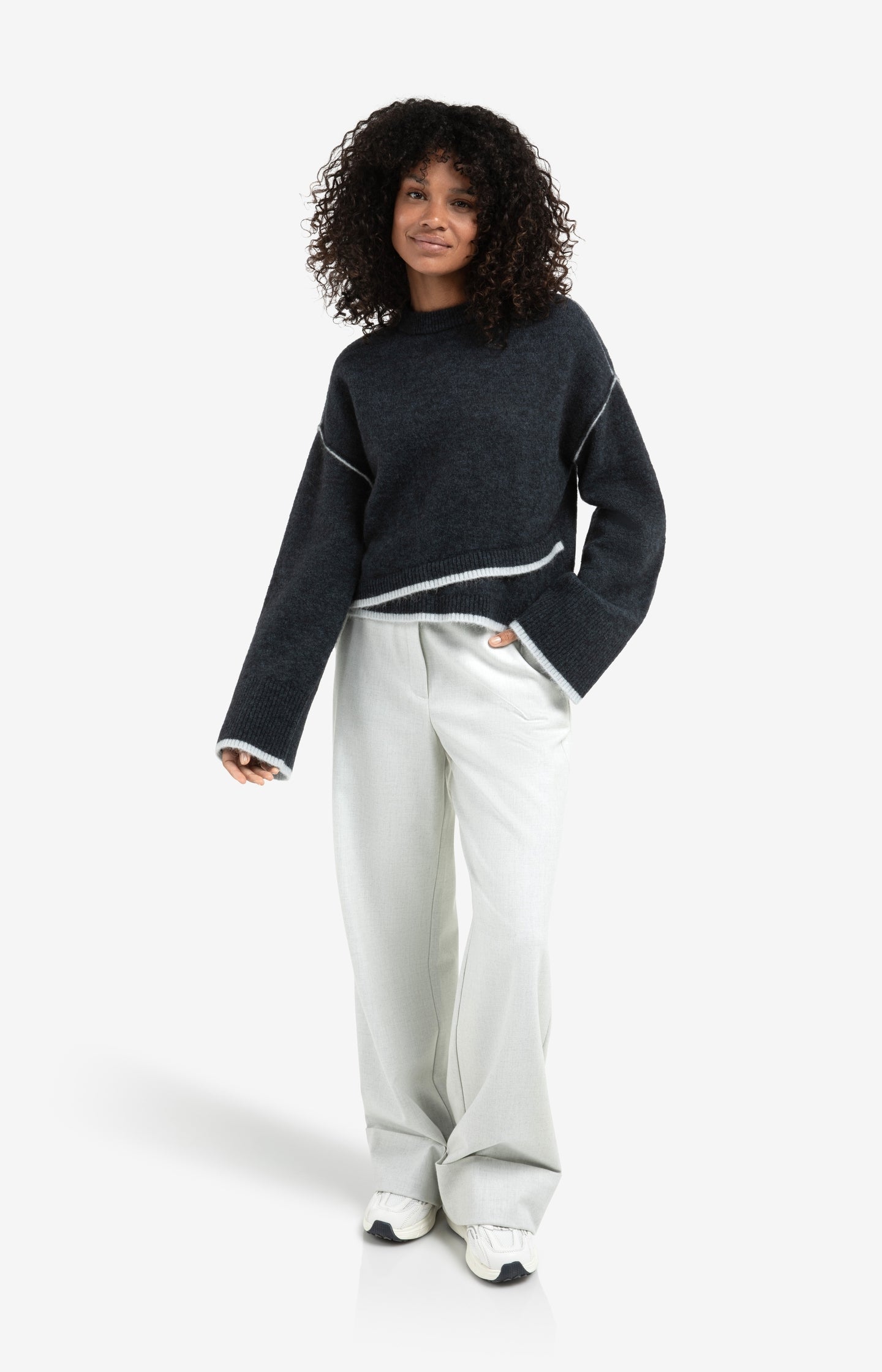 Knitted sweater with contrasting lines