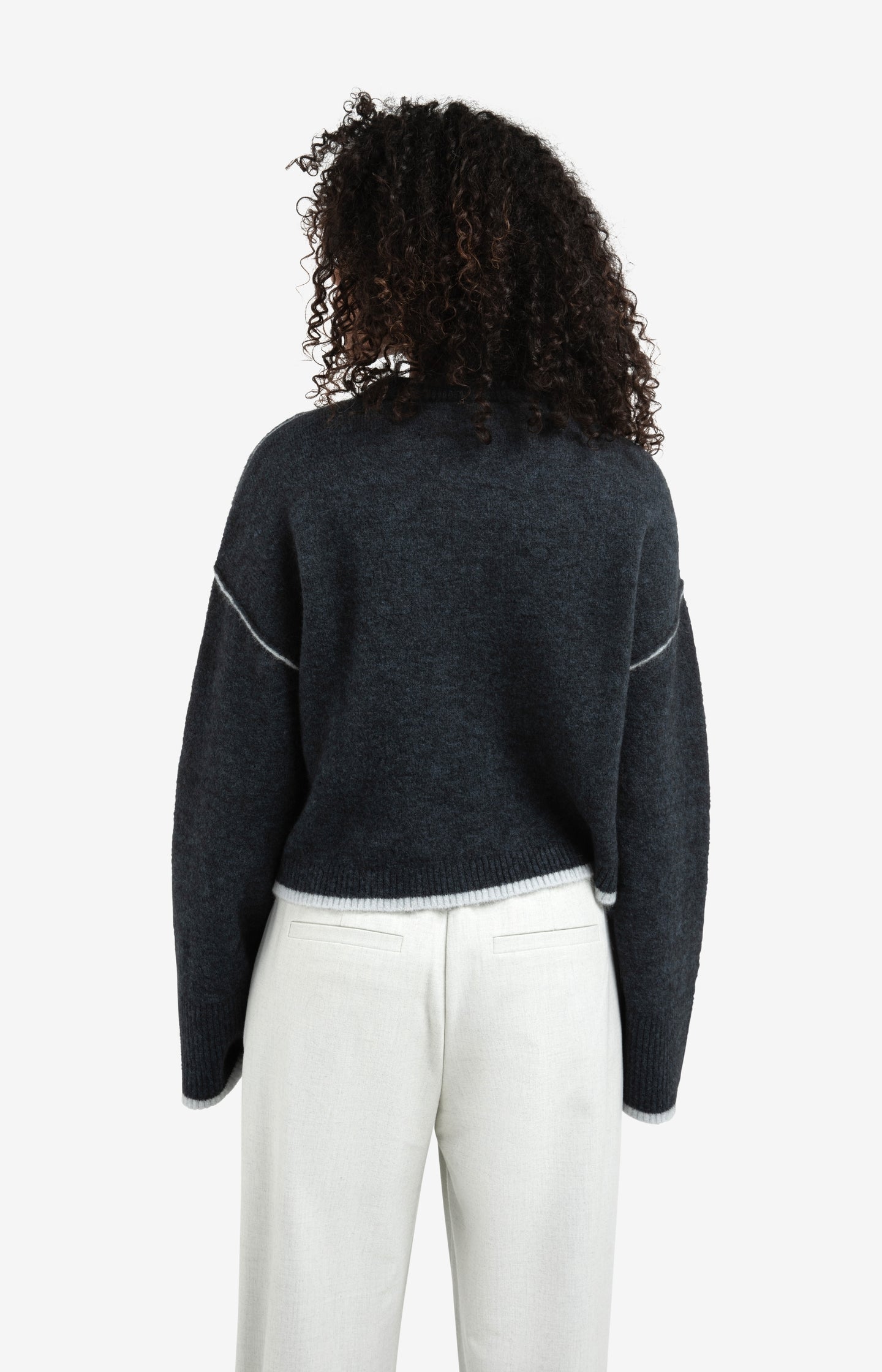 Knitted sweater with contrasting lines