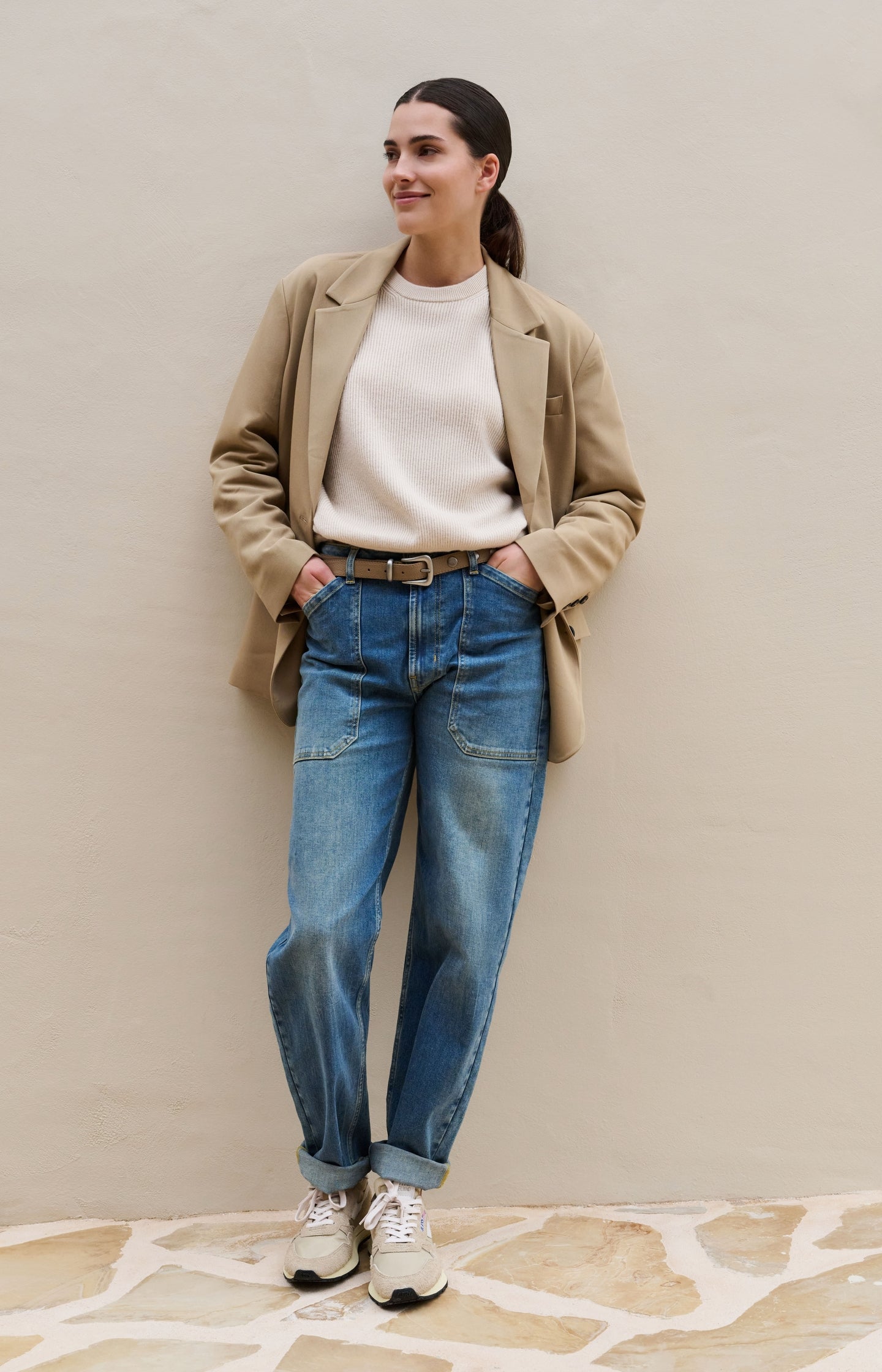 Knitted sweater with tie details at the hem