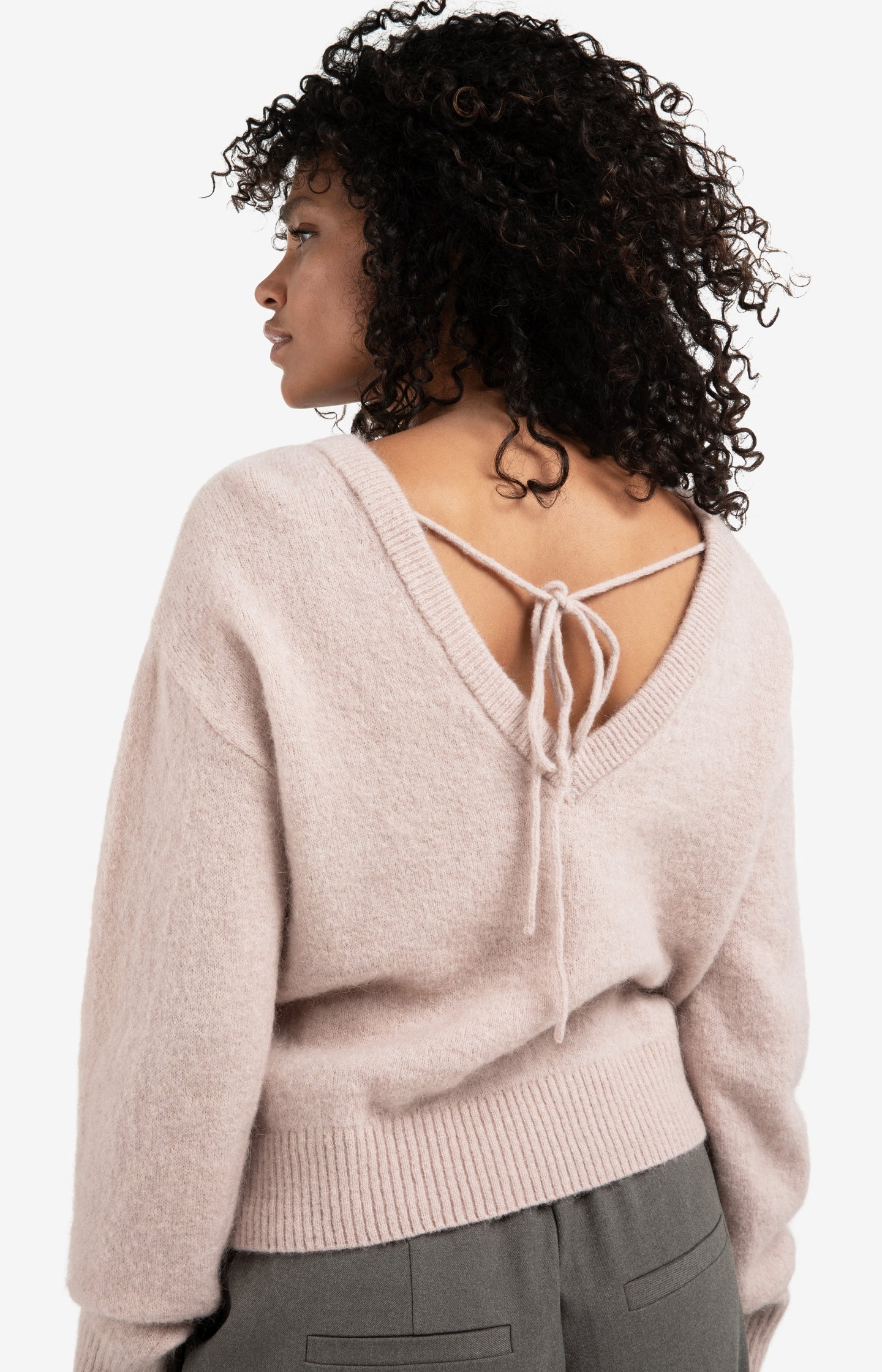 Soft sweater with V-back and tie detail